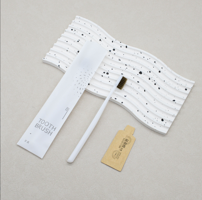 通货-白背空星光膜丽枫款（送纸袋牙膏）牙刷克重：全新料6克pp聚丙烯 刷毛：0.15mm咖棕火焰毛 牙膏：3g氨基酸牙膏 包装：12丝星光膜 孔数：28孔（1000/箱）整箱发货