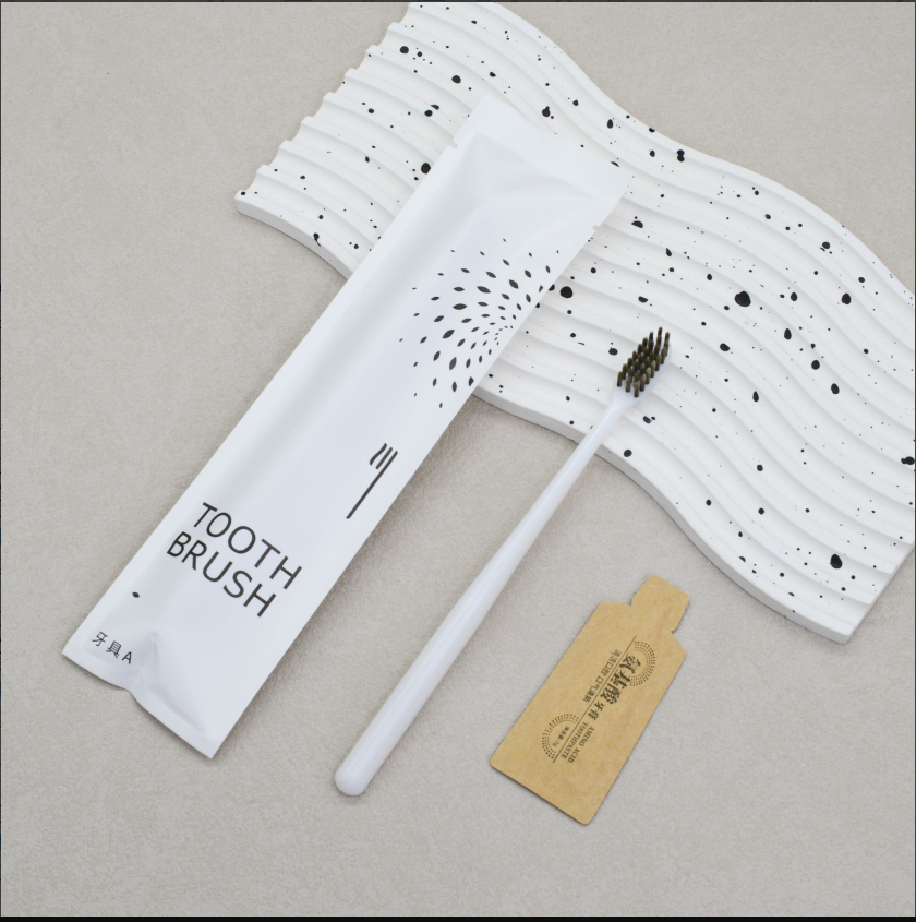 通货-白背空石头纸（送纸袋牙膏）牙刷克重：全新料6克pp聚丙烯 刷毛：0.15mm咖棕火焰毛 牙膏：3g氨基酸牙膏 包装：三边封石头纸 孔数：28孔（1000/箱）整箱发货