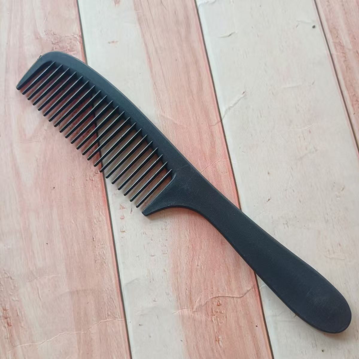 星光膜 黑半月梳梳子克重：10克 材质：pp 包装：12丝星光膜